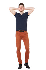 Full body happy young man with hands behind head against white background
