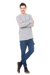 Full length attractive young man against white background