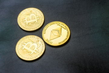 Crypto currency. Coins Bitcoin (BTC), banknotes one hundred dollars sticking out of a man's black leather purse on a wooden background.Blockchain.Intarnational currency.Top view.E-commerce.E-business.