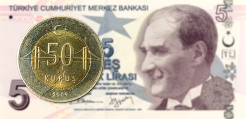 50 turkish kurus coin against 5 turkish lira banknote