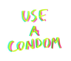 Phrase "use a condom" hand written in highlighter felt tip pen on clean white background