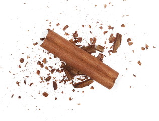Cinnamon sticks with shavings isolated on white background, top view