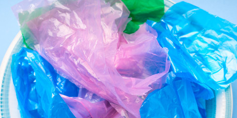 Colorful pastic bags texture closeup. Plastic use or disposal concept