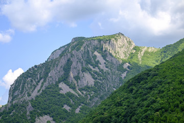 Fototapeta premium Peak of a mountain against a blue sky 1
