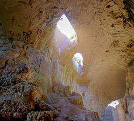 Panorama of the cave with falling light from above