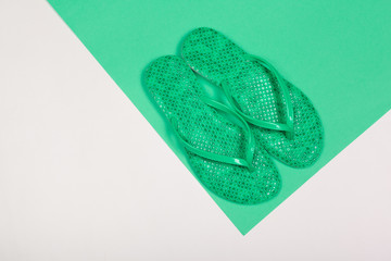 Beach flip flop on color background