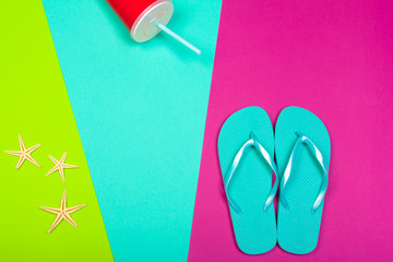 Beach flip flop on color background