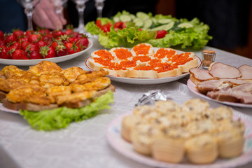 snacks and food on the buffet table indoors
