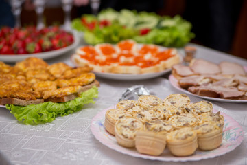 snacks and food on the buffet table indoors