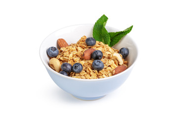 Bowl of homemade granola with fruit pieces isolated on white