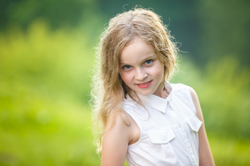 Fototapeta premium close up portrait of little beautiful stylish kid girl on green background