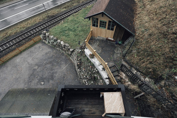 Hotel and coffee house near the train. Railway in the mountains