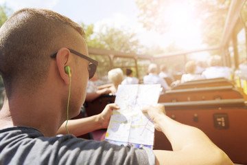 young man traveling on a tour bus