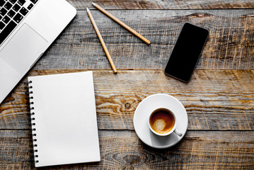 Working place with laptop on wooden table