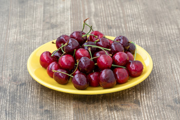 Plate with fresh picked cherries