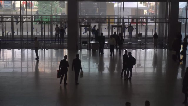 silhouettes of business people in the lobby of the business center