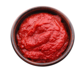Bowl with delicious tomato sauce on white background