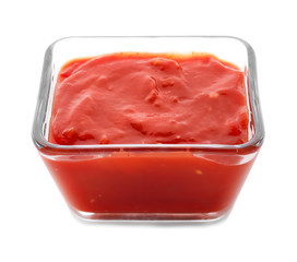 Bowl with delicious tomato sauce on white background