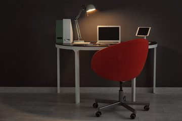 Comfortable workplace with laptop on table