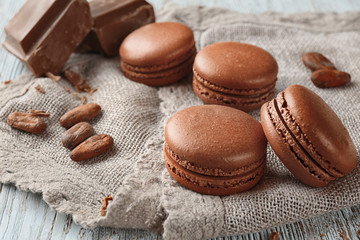Delicious chocolate macarons on cloth