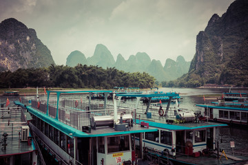 Li River (Lijiang River). Pleasure boats at the pier in Xingping Town