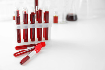 Test tubes with blood samples on table