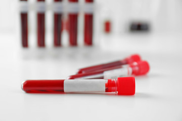 Test tubes with blood samples on table