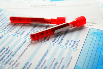 Test tubes with blood samples on forms