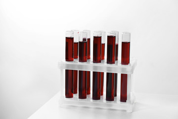 Test tubes with blood samples in holder on table