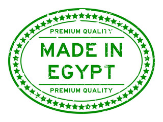 Grunge green premiumq quality made in Egypt oval rubber seal business stamp on white background