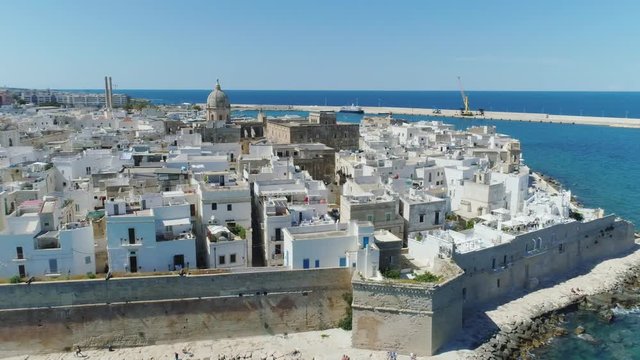 White city Monopoly and blue sea coastline in Italy Drone flight 4k