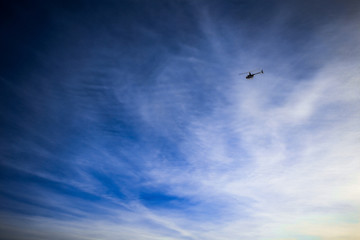 Helicopter landing in sky