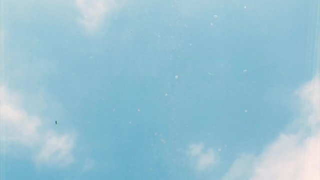 Time-lapse of clouds through bedroom window on a beautiful sunny day