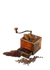 coffee ground and in grains isolated on white background. old coffee grinder.
