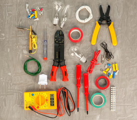 Flat lay composition with electrical tools on grey background