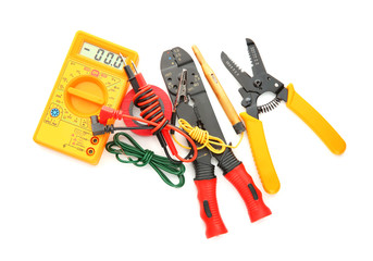 Different electrical tools on white background, top view