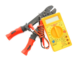 Different electrical tools on white background, top view