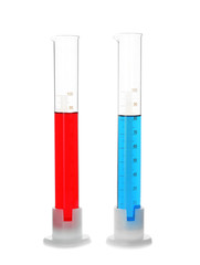 Test tubes with red and blue liquids on white background