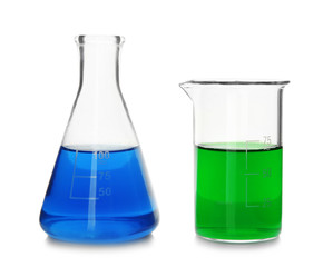 Chemical glassware with colorful samples on white background