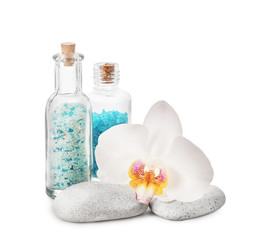 Beautiful spa composition with sea salt and stones on white background