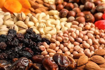 Different nuts, dried fruits and berries, closeup