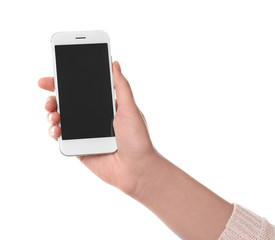 Young woman holding smartphone on white background