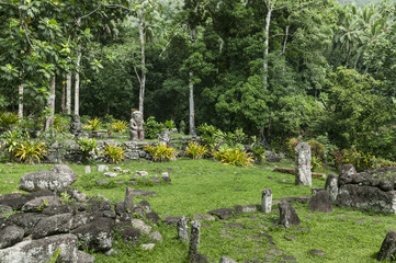 historic stone statues, so called Tikis, created by native inhabitants of Hiva Oa,  Marquesas...