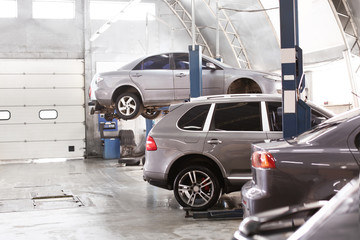 Interior of car service center with automobiles