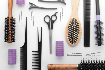 Professional hairdresser's set on white background, top view