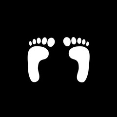 White silhouette of human footprints on black background.