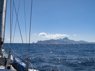 approaching Ua Pou Island from sea, Marquesas Archipelago, French Polynesia, spectacular landscape with extremely steep mountains