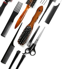 Professional hairdresser's tools on white background, top view