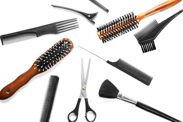 Professional hairdresser's tools on white background, top view