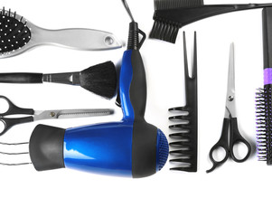 Professional hairdresser's tools on white background, top view